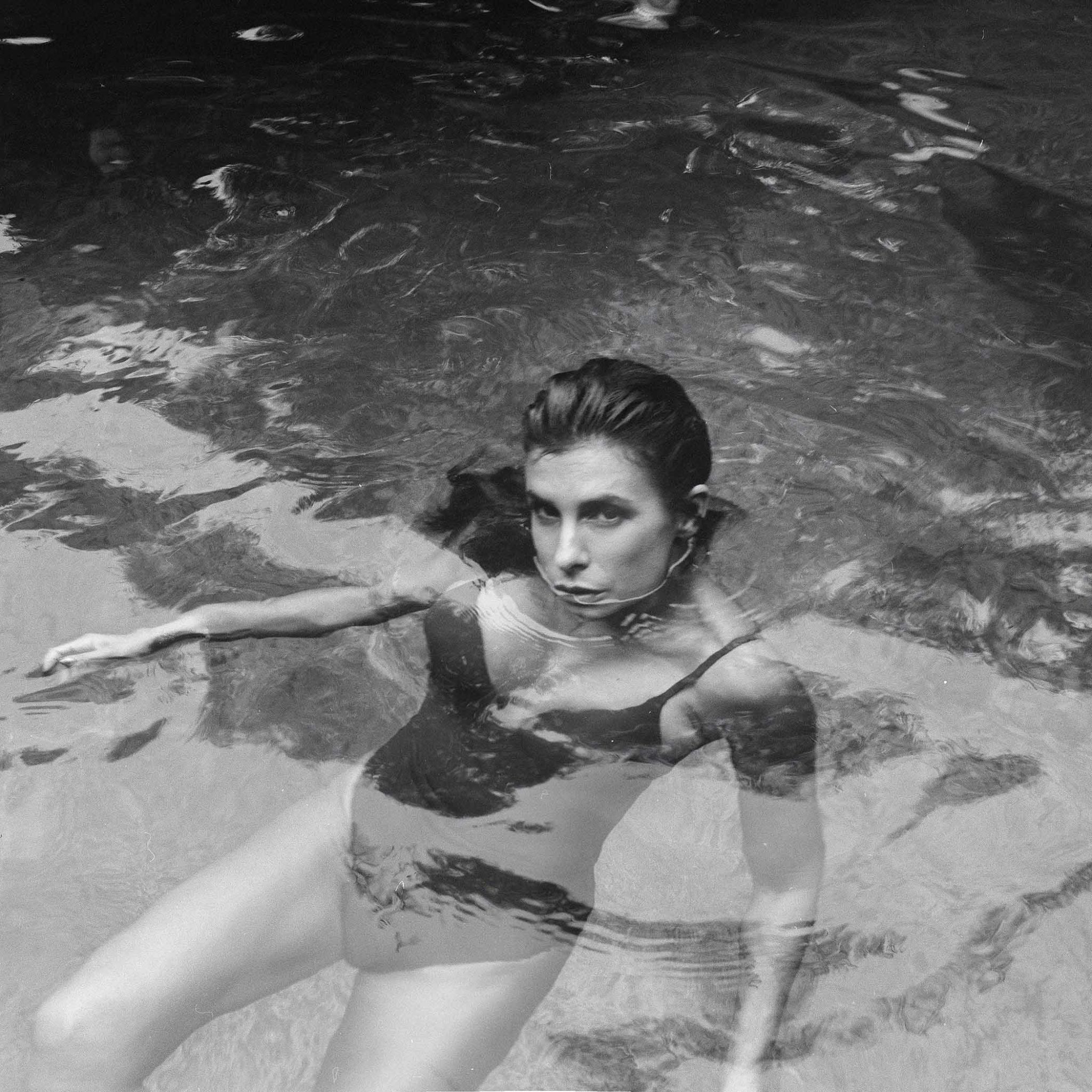 Elisabetta Canalis swimming in the pool.