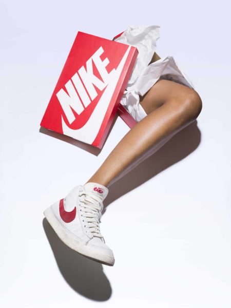 Leg with a white nike sneaker on